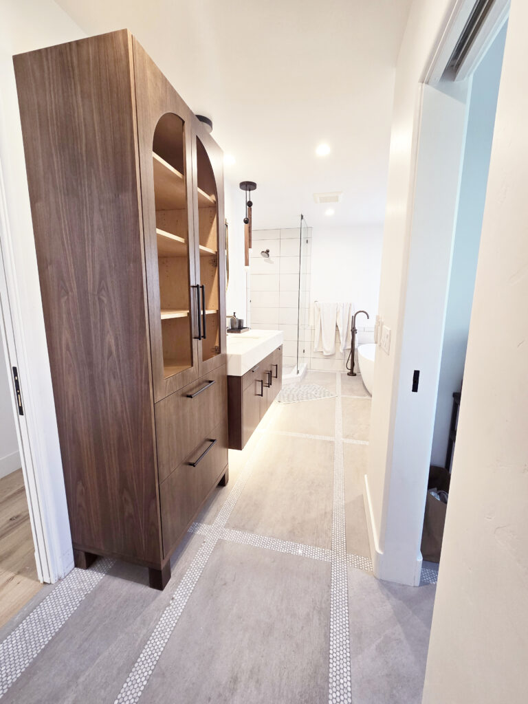 Refined custom bathroom cabinets in the Van de Sande Master Bath by Caliber Woodcraft